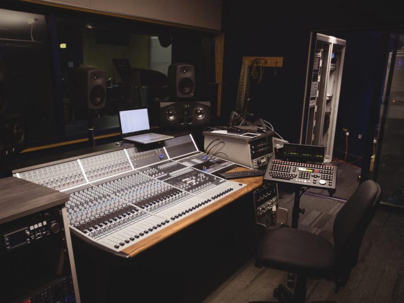 Sound mixer in a studio with laptop Sound mixer in a studio with laptop
